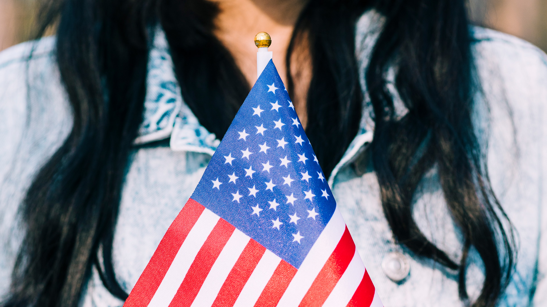 Naturalization themed image, USCIS policy manual update on false claims to US citizenship