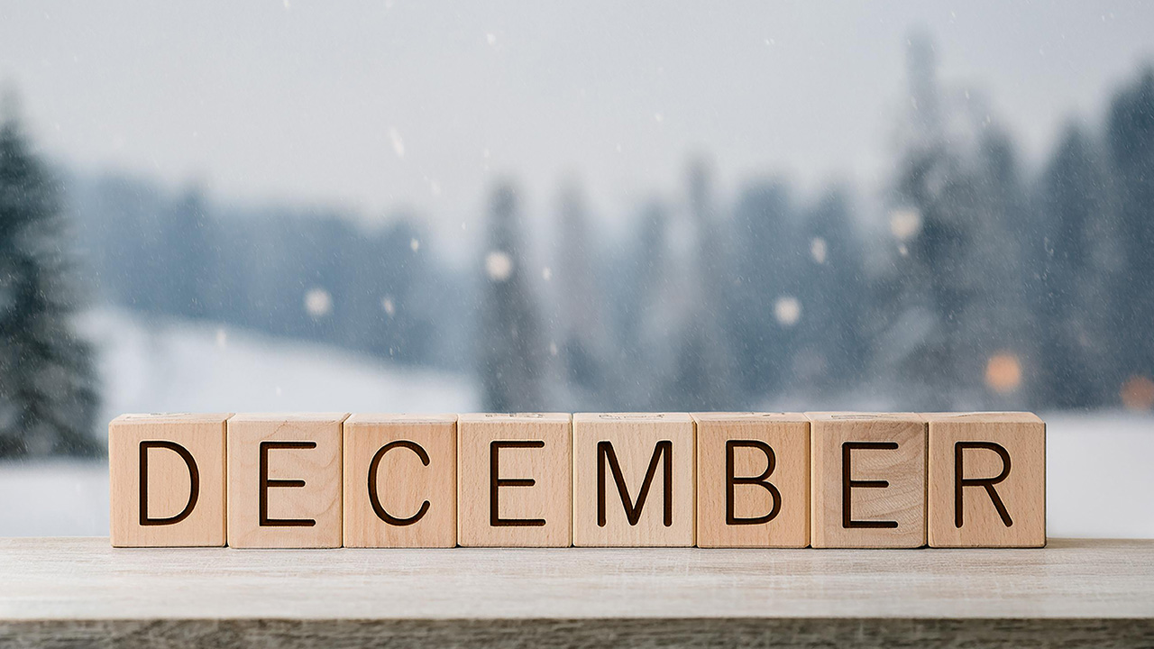 Wooden blocks spell December against a snowy winter backdrop, December 2025 visa bulletin