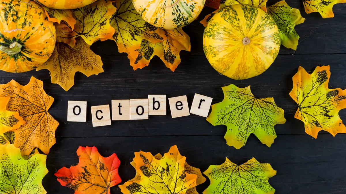October text with pumpkins and autumn leaves on a dark wooden table, October 2026 visa bulletin