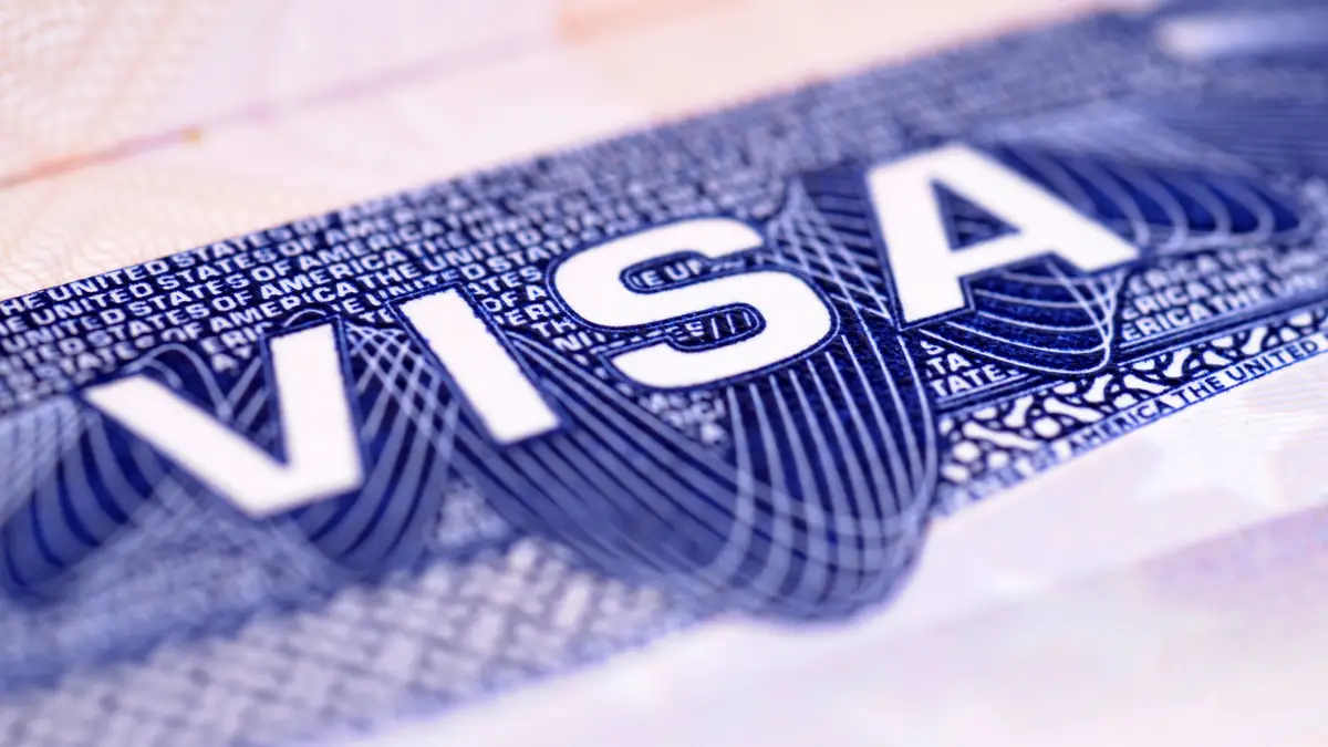 Close-up of a United States visa, DHS proposal to eliminate the 60-day grace period for nonimmigrant workers