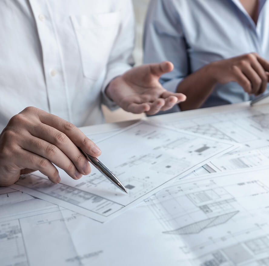 Meeting looking over blueprints