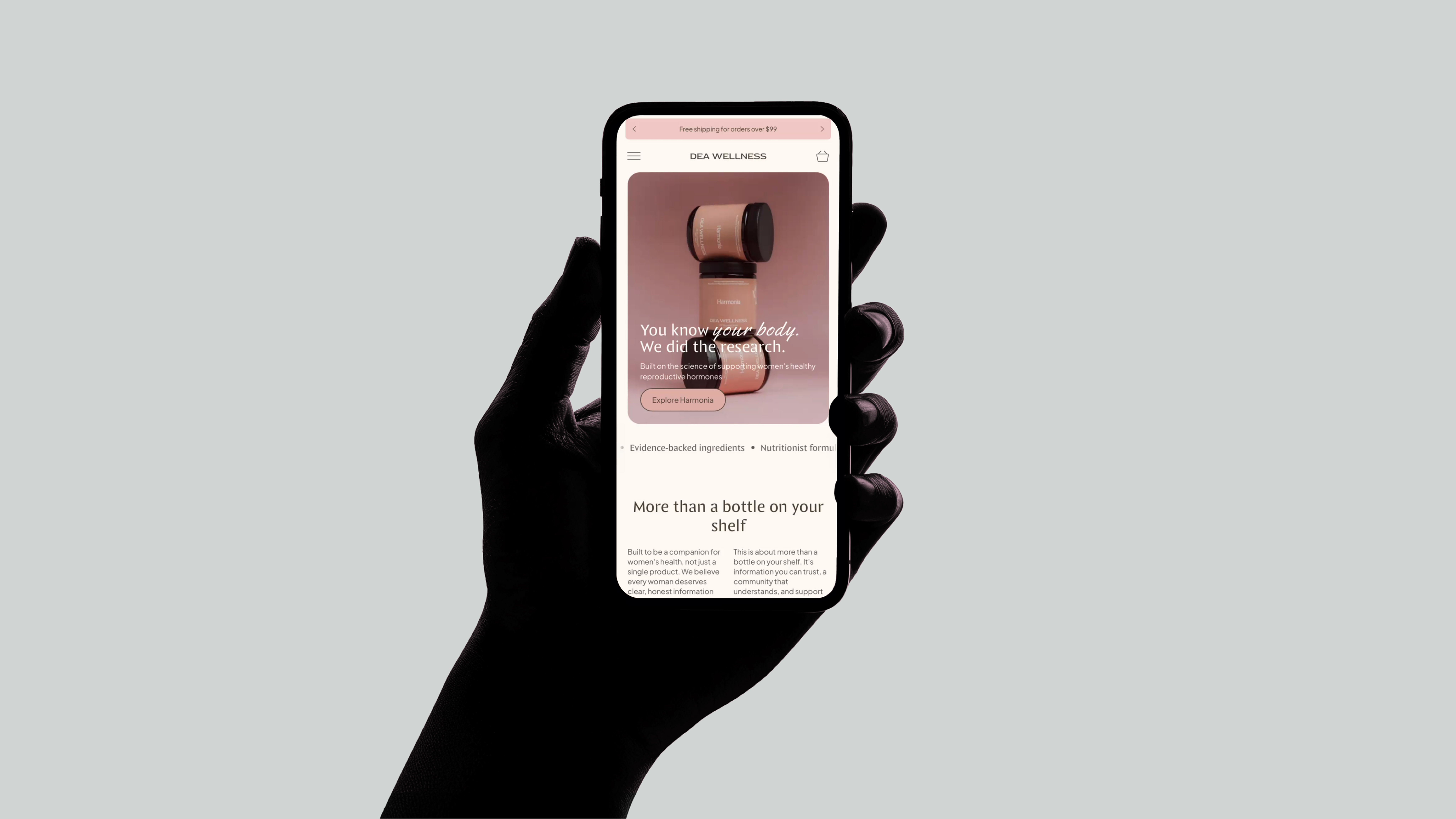 A Shopify storefront designed by Emán Estudio, shown on a phone