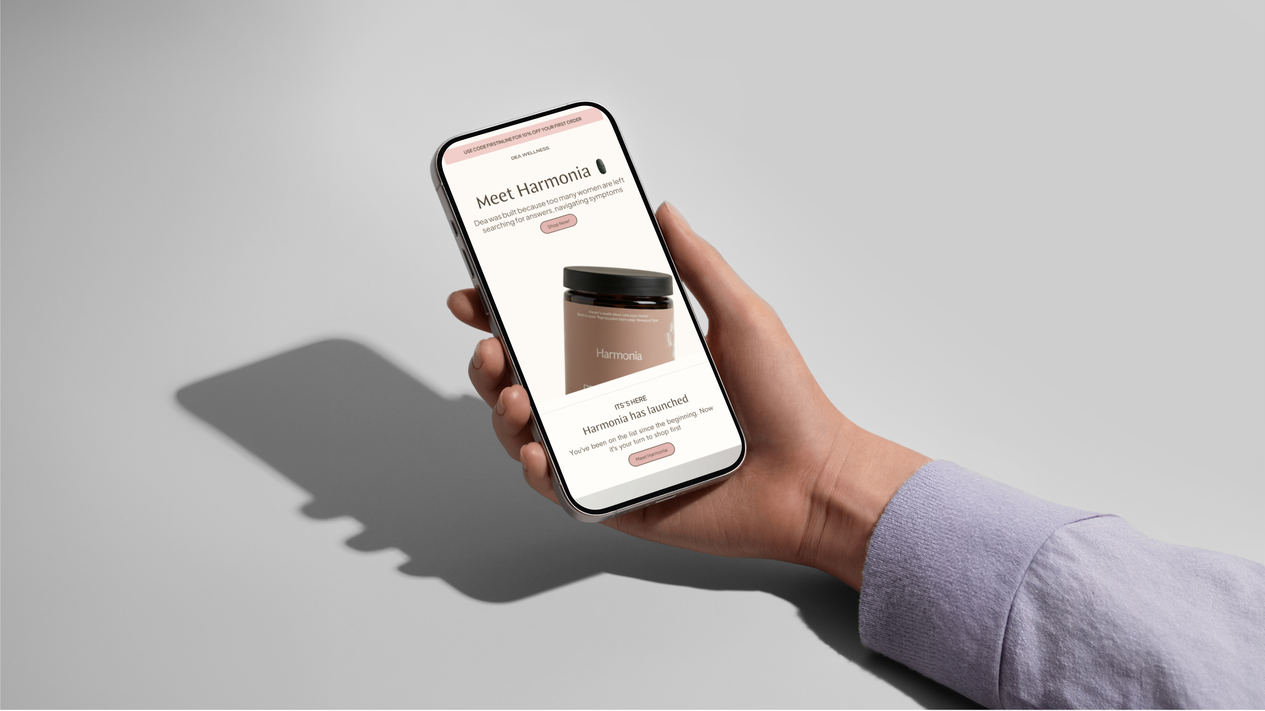 A branded email designed by Emán Estudio, shown on a phone