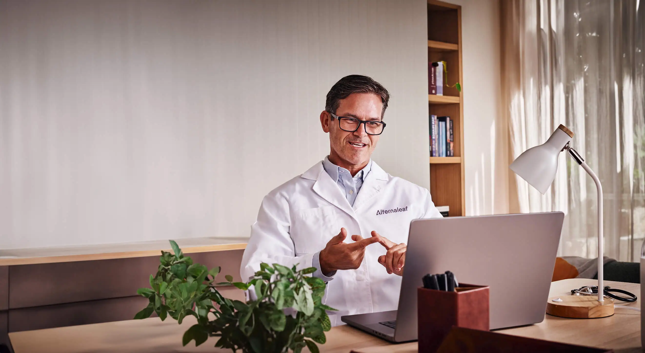 A doctor in a telehealth consultation.