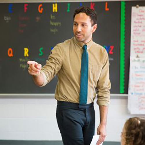 A men is teaching in classroom