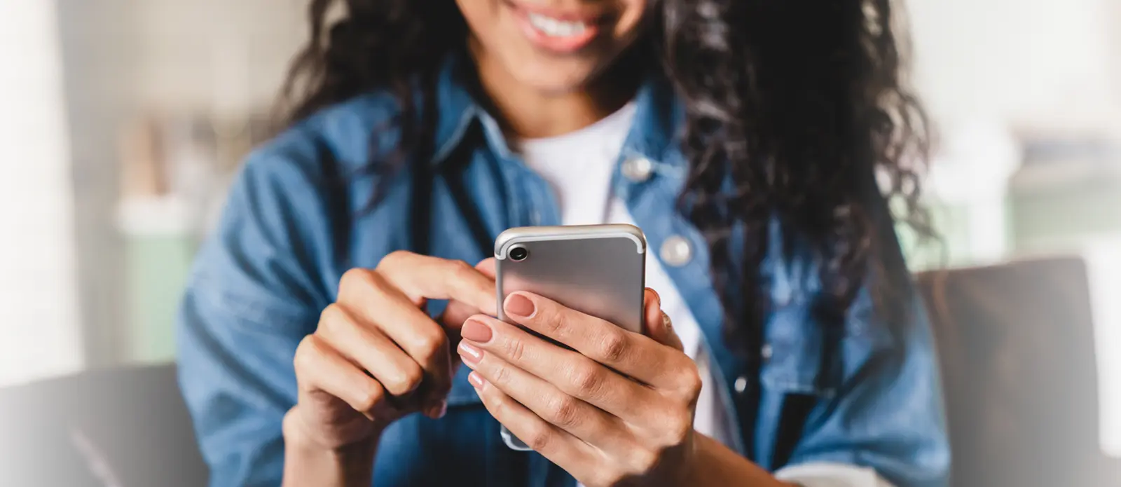 Girl smiling looking at phone