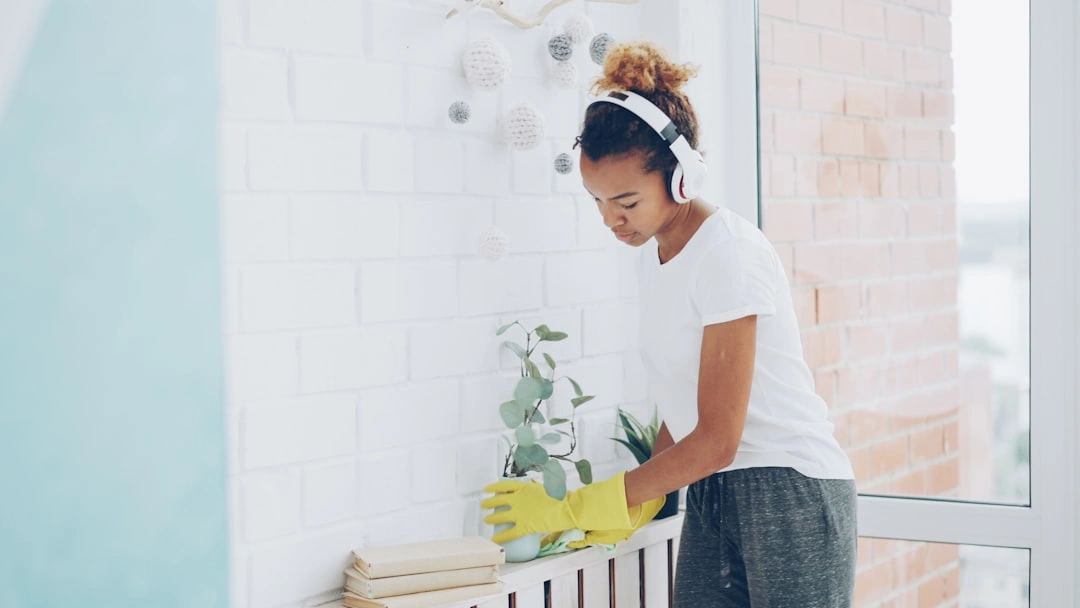 homeowner wearing N95 mask cleaning indoor surfaces