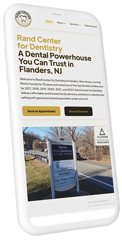 A cell phone displaying a dental website.