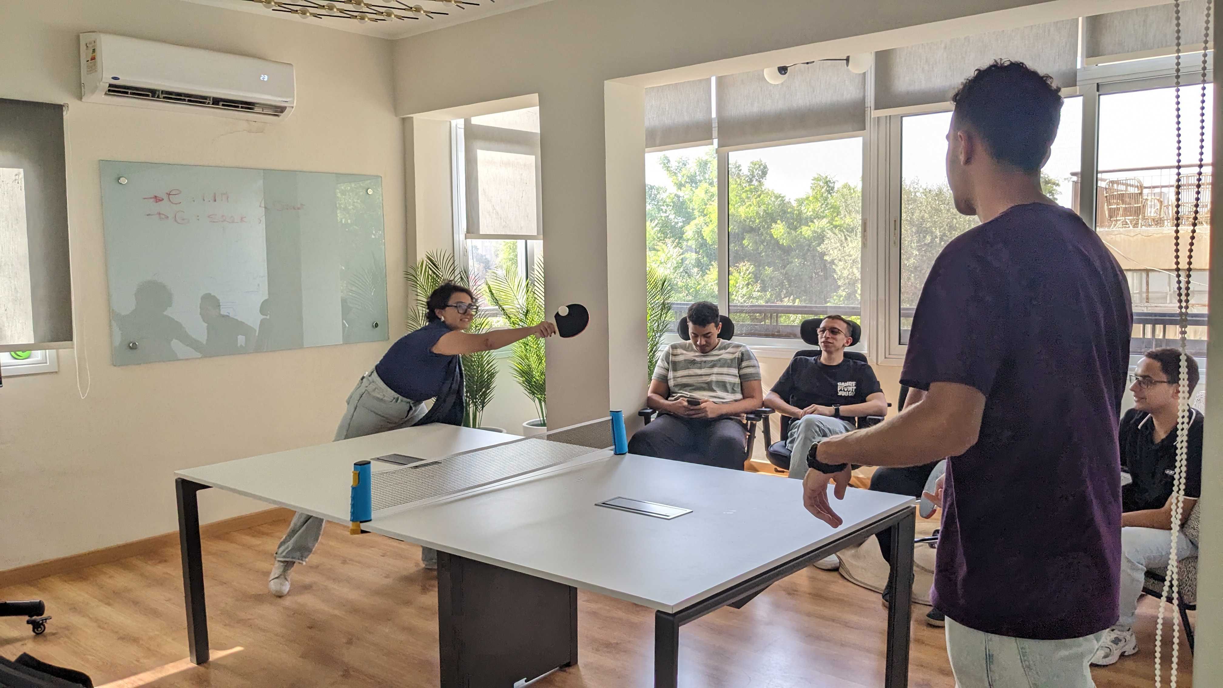 Team playing ping pong post sprint review