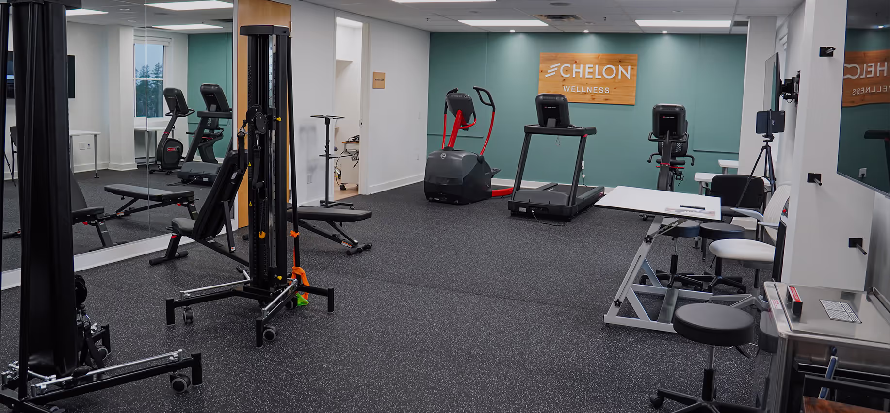 Interior of Echelon Wellness clinic featuring a treatment table and modern decor