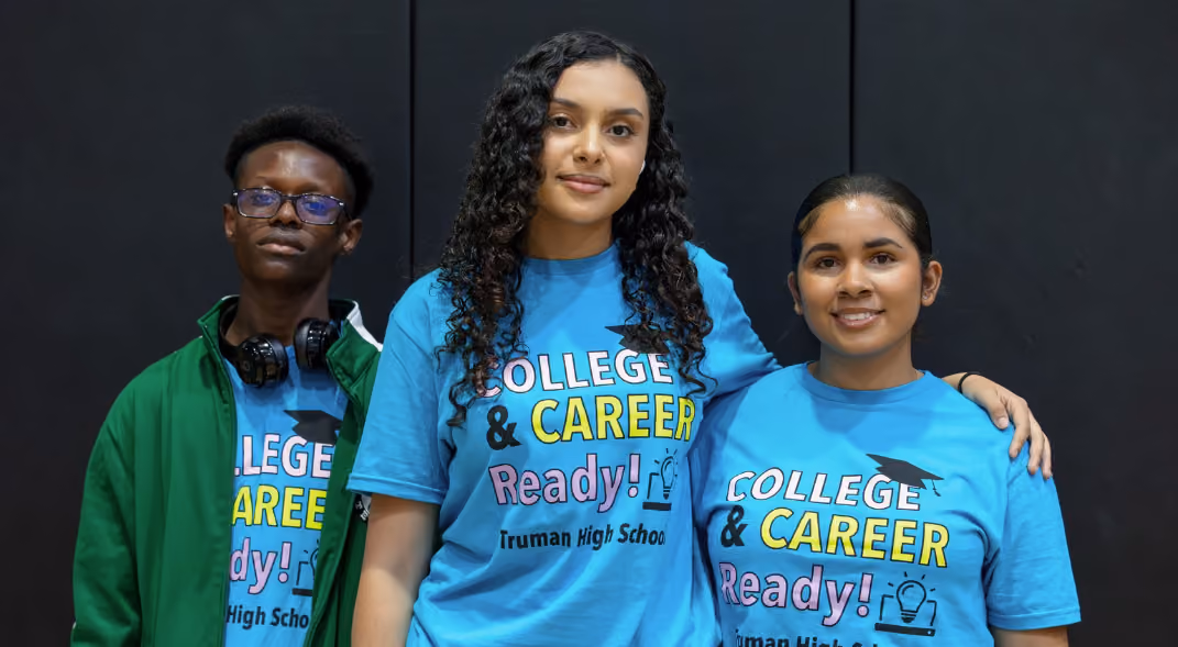 Truman students in blue shirts