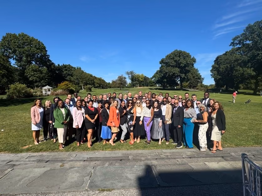 Educators group posing outdoors


