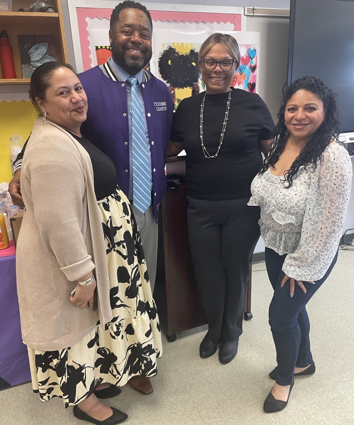 Educators posing in classroom