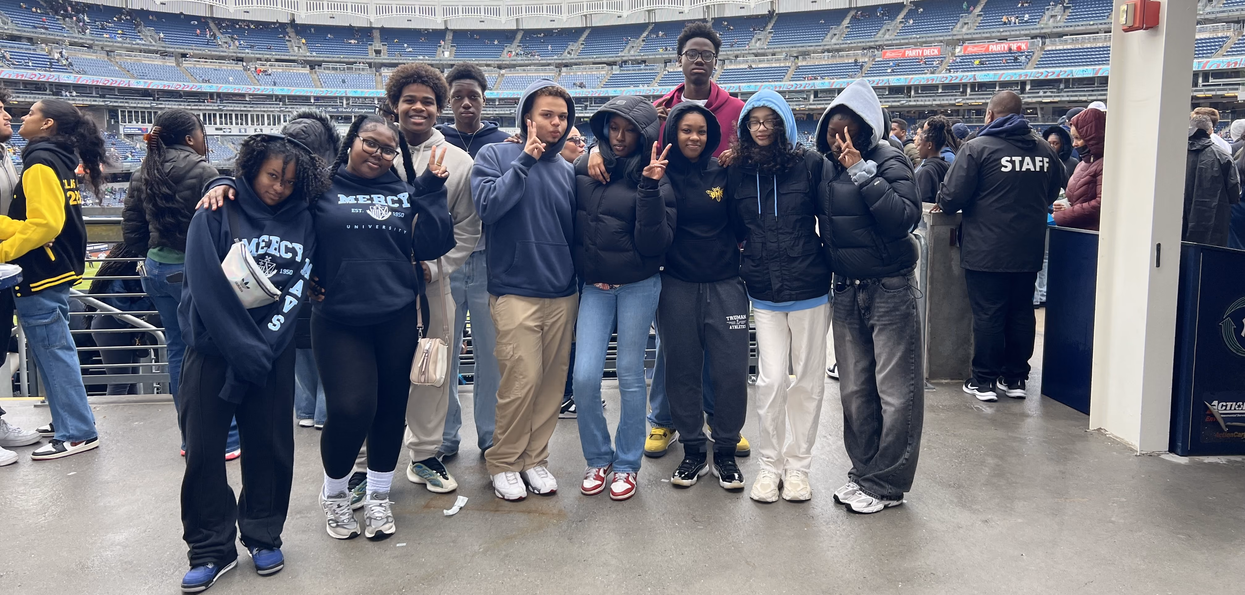 Students posing at stadium
