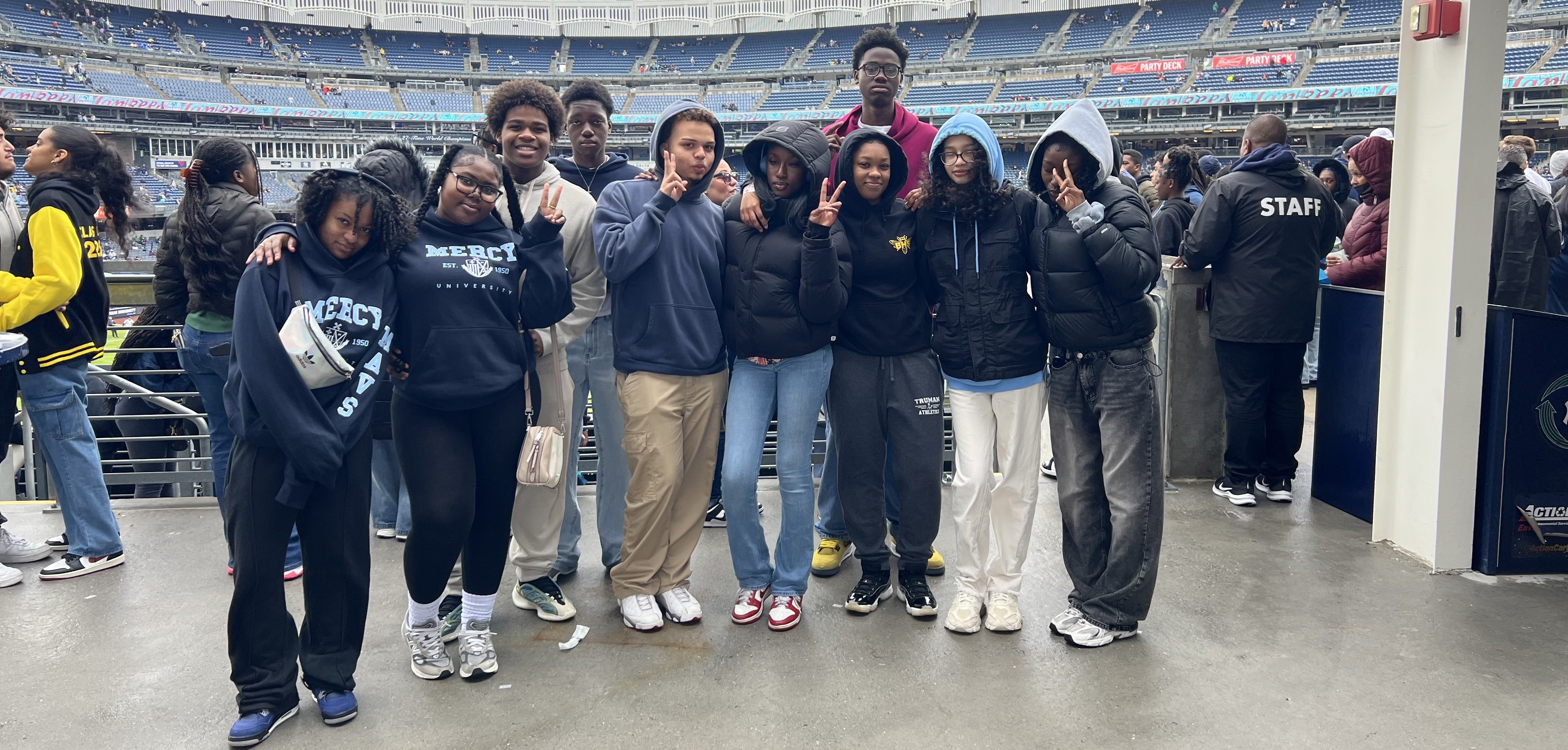 Students posing at stadium