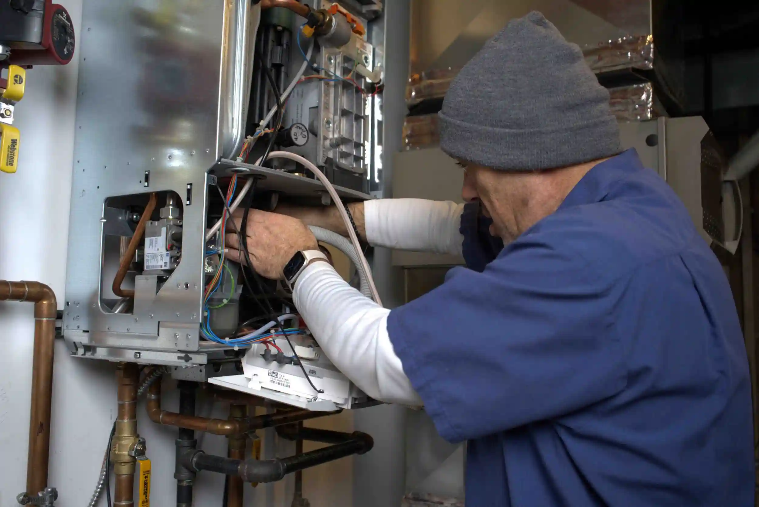 Man installing a new heating unit
