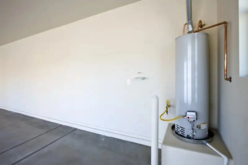 Side view of a stainless steel tank water heater
