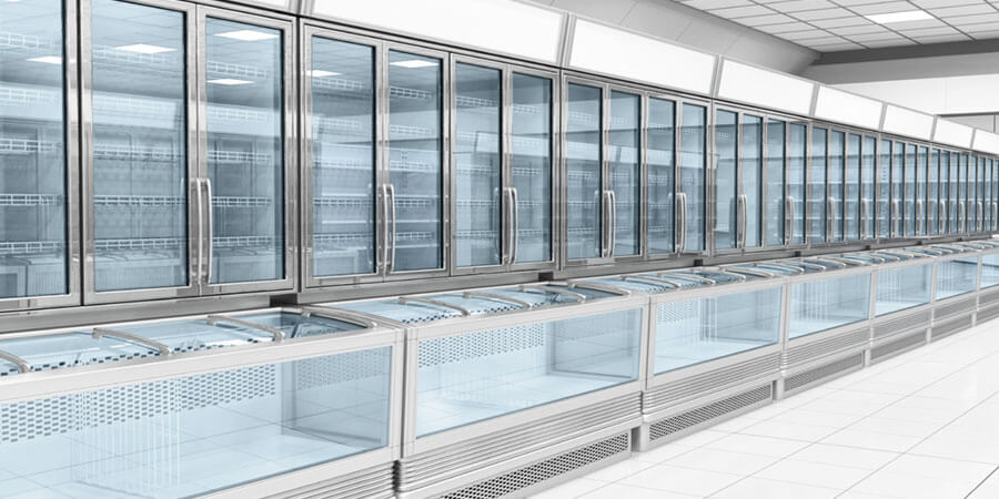 A row of empty commercial store refrigerators.