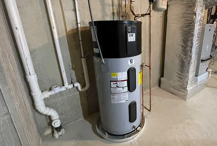 The image displays a hybrid heat pump water heater, an energy-efficient alternative to traditional electric resistance models.