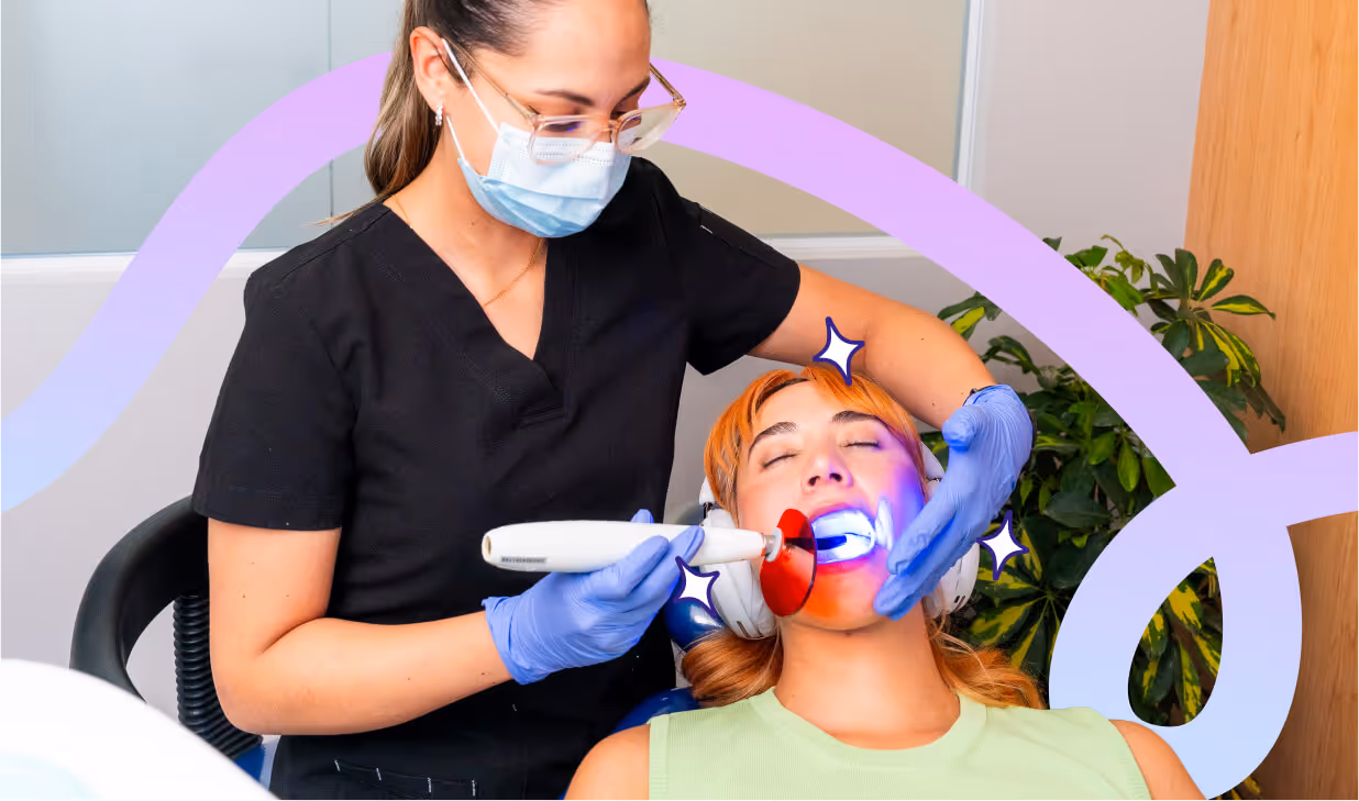 Dentist curing a composite dental filling for a patient at hisonrisa clinic in Mexico City