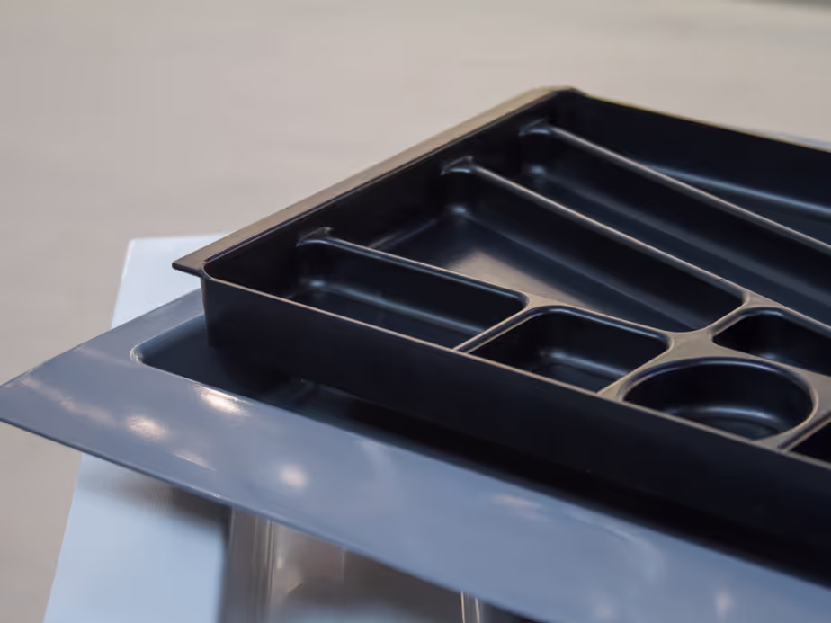 Black thermoformed plastic tray