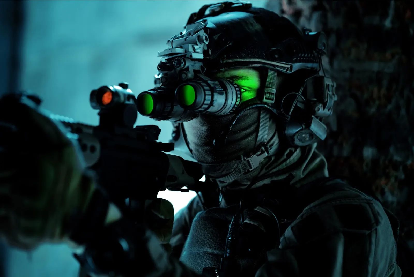 Operator wearing green night vision goggles