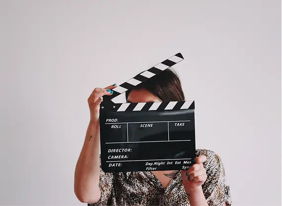 Person holding a filmmaking slate