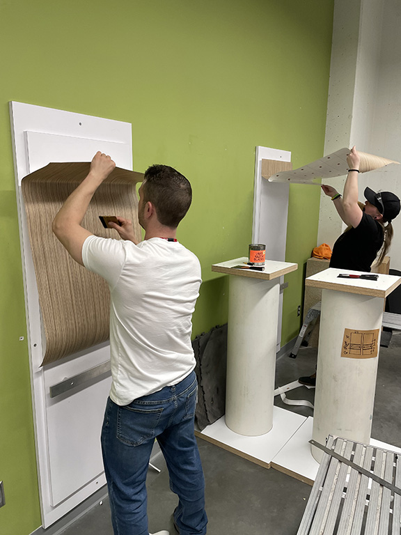 Dr. Auto Credit Banner on cutting table.