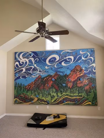 climbing wall with art on it