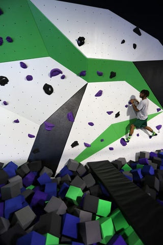 Cimber in the bouldering wall at Spider Monkey Extreme Airsports in Aurora, CO
