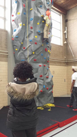Derrick has a chance to scale a Gecko Modular Climbing Wall in the Rebecca K. Crown Youth Center in Chicago, IL