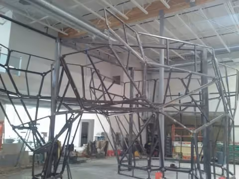 The steel frame that will support the surface panels for the Portland Rock Gym climbing walls are almost finished.