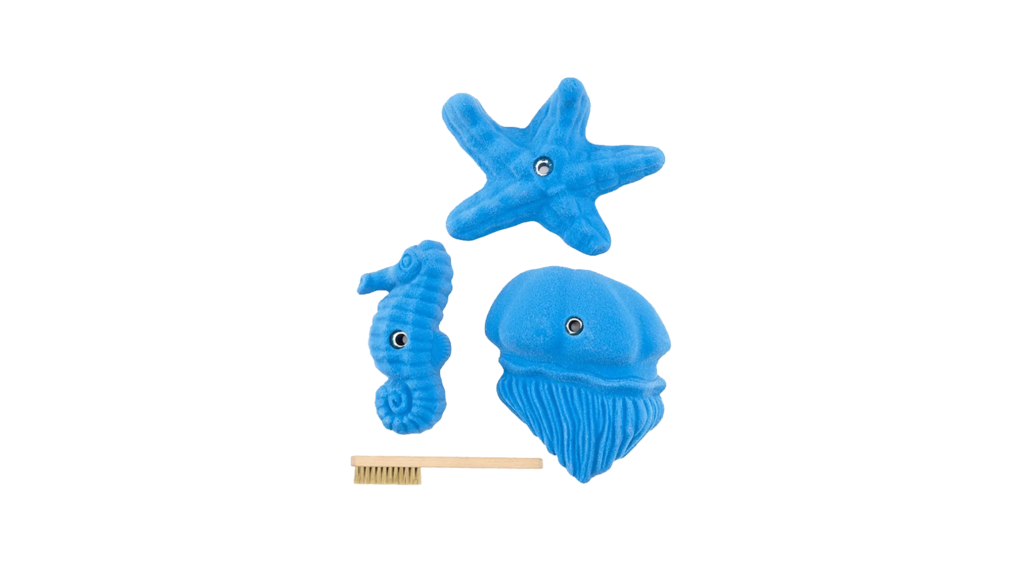 Sea Food climbing holds in blue: a starfish, a seahorse and a jellyfish, shown with a hold brush