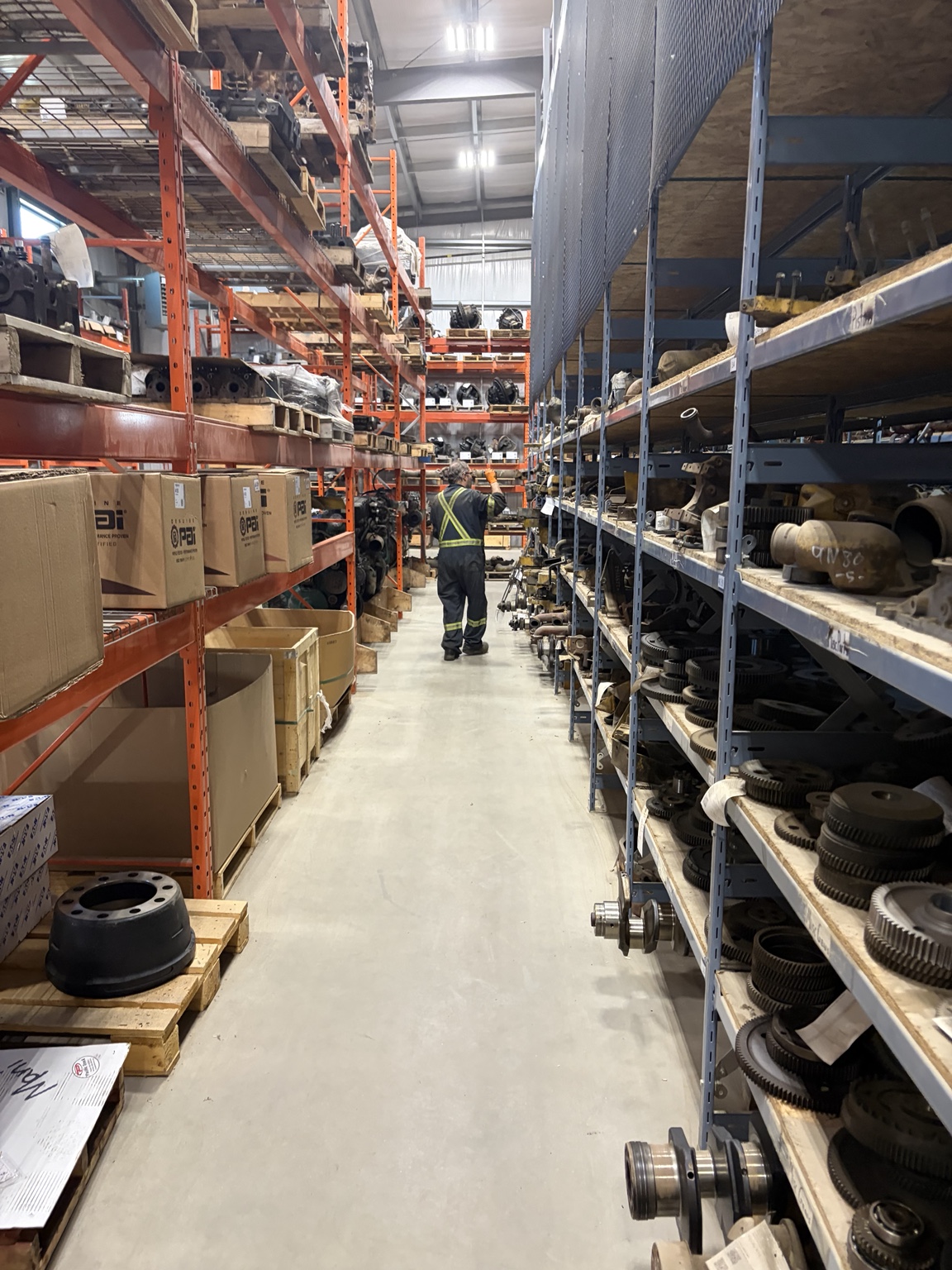 Parts inventory and a team member in the K&D warehouse