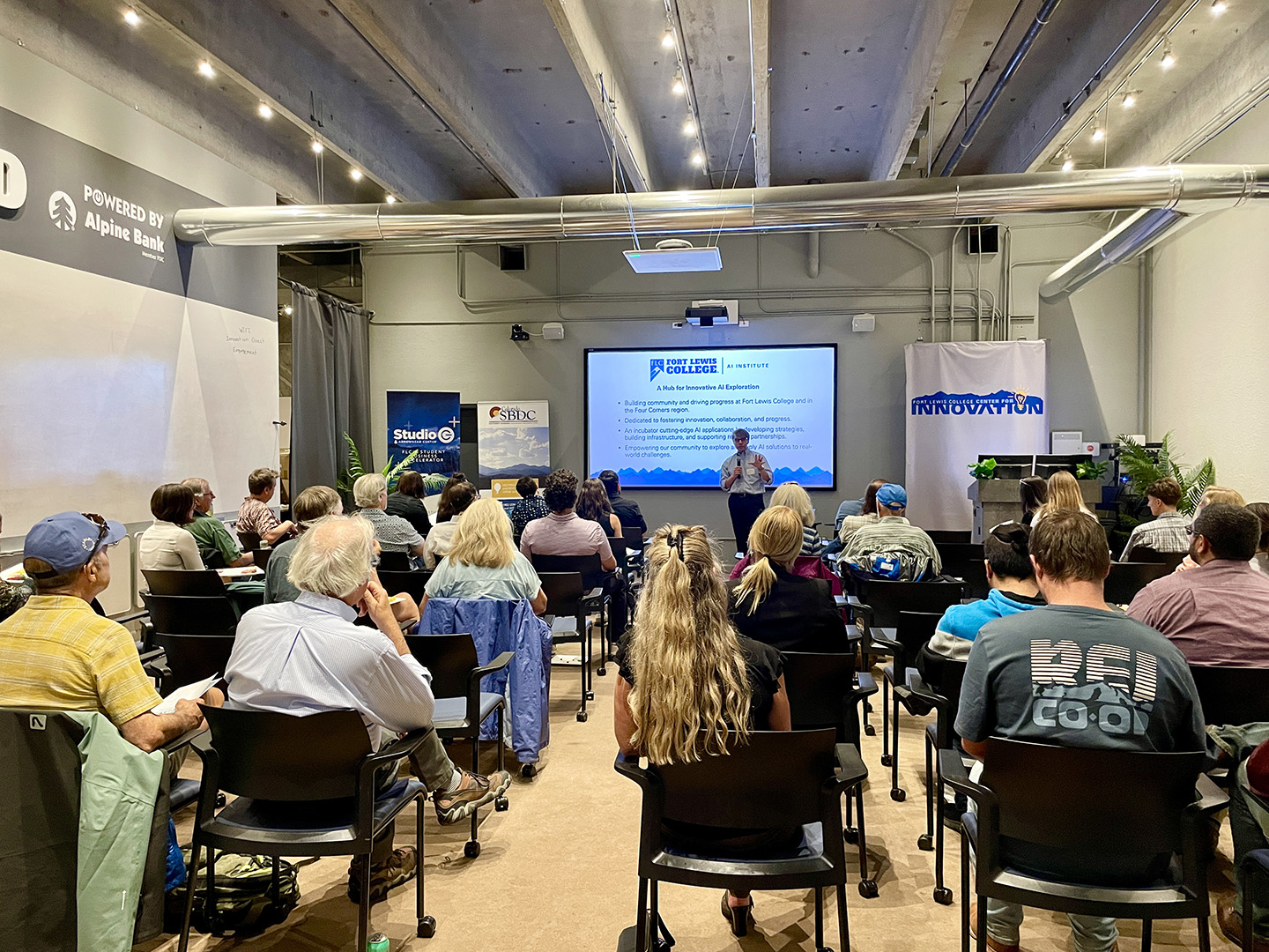Audience listens to presentations at the Elevate AI community celebration.