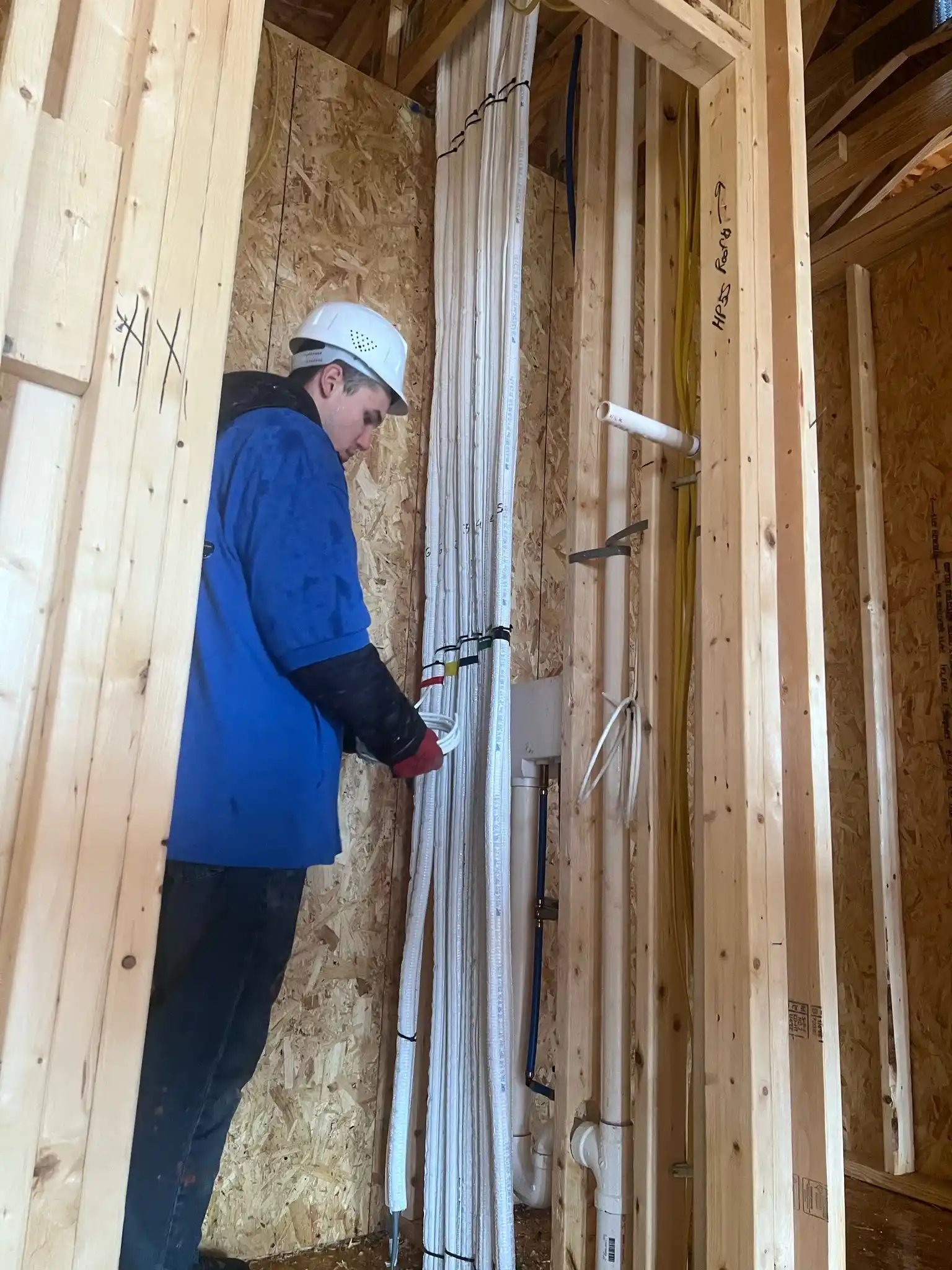 Worker checking the ac pipes