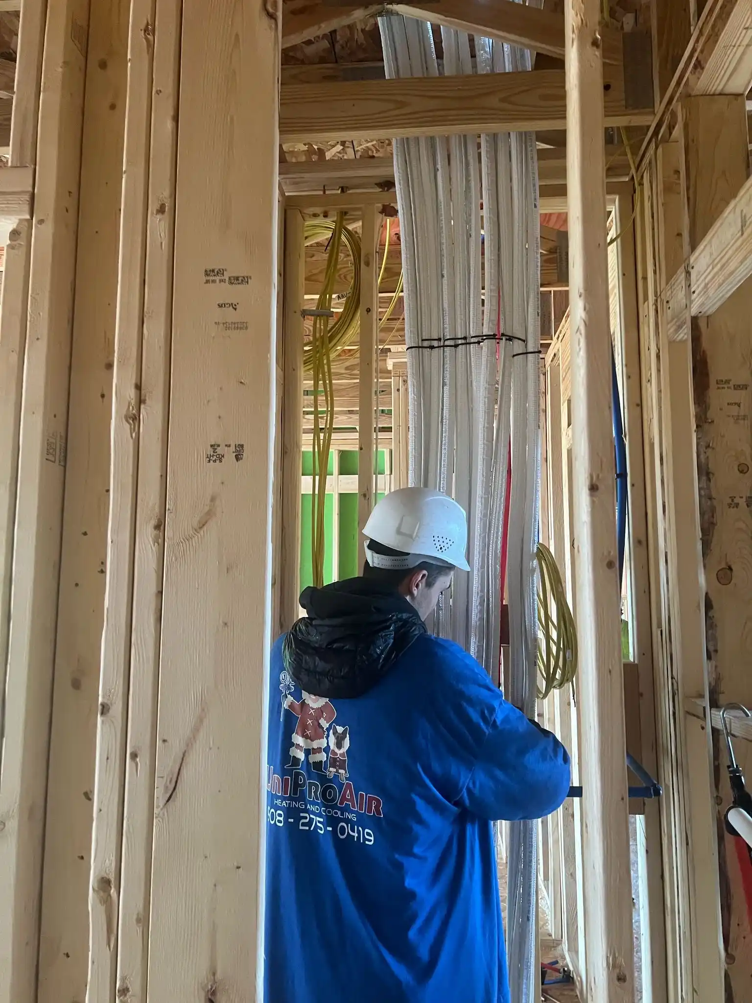 Man checking for ac pipes