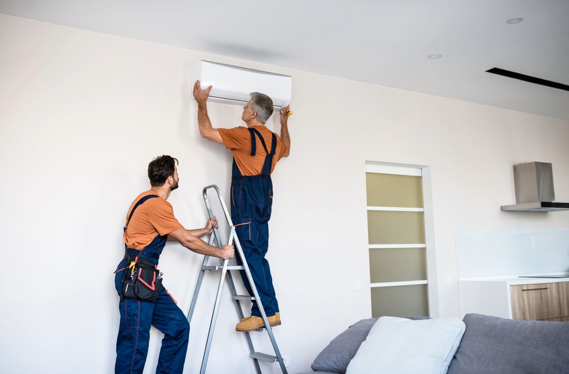 Air conditioning replacement Perth technicians installing a new split system