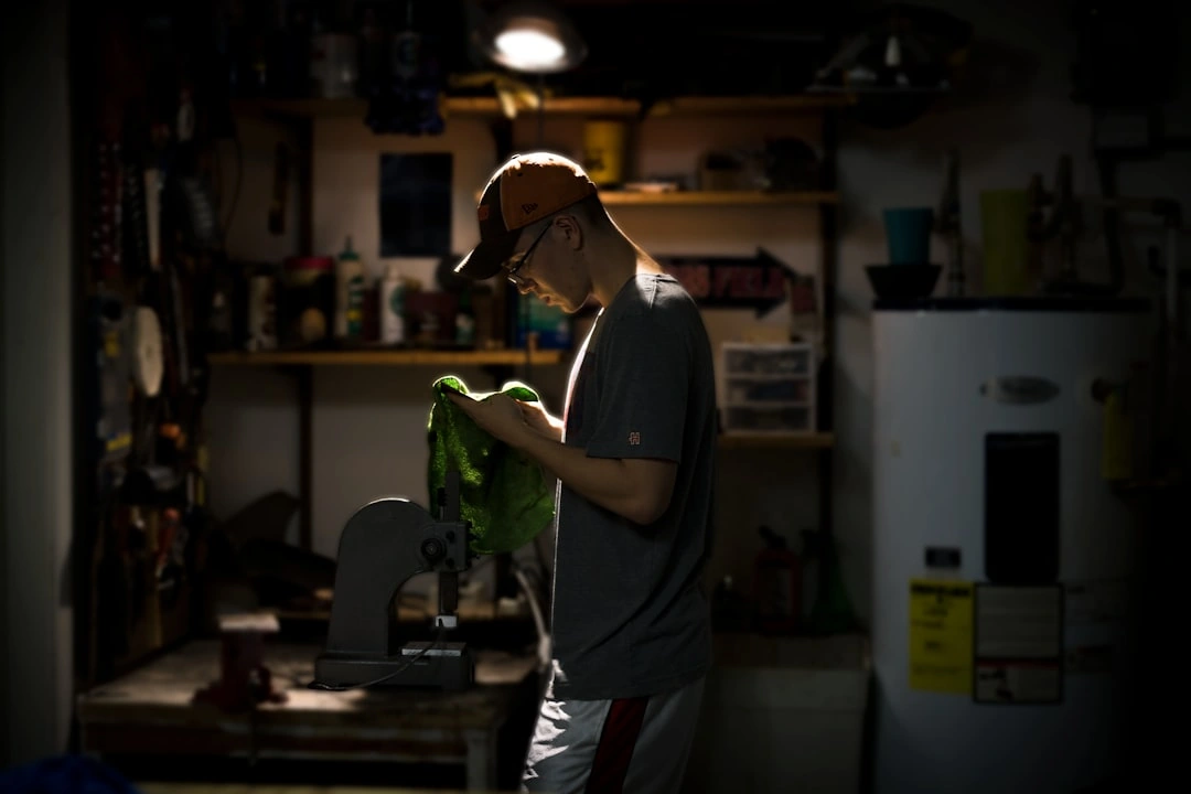 homeowner inspecting a clean hvac air filter - how to maintain your heating and cooling system