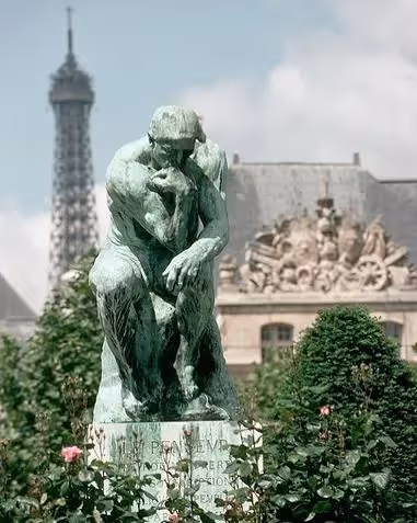 Sculpture The Thinker exhibited near a hotel residence on a mobility lease, Yuna.