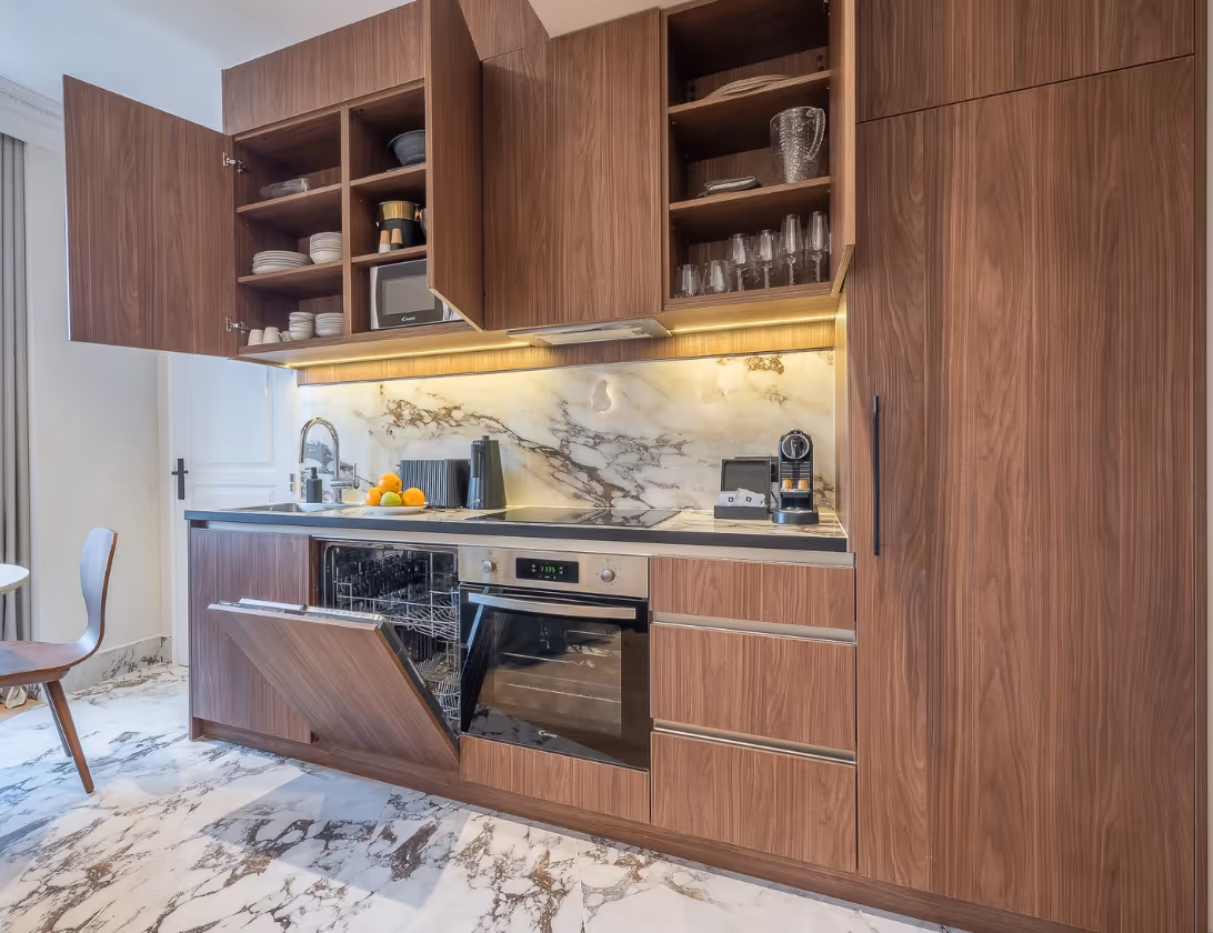 Fully equipped kitchen in a furnished Yuna apartment, perfect for a business stay or a short-term rental in a hotel residence.