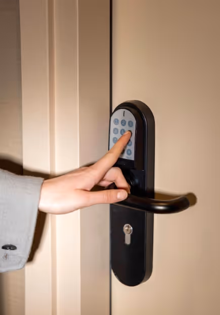 Person who taps on the door code of a furnished apartment hotel for short term rental, Yuna.