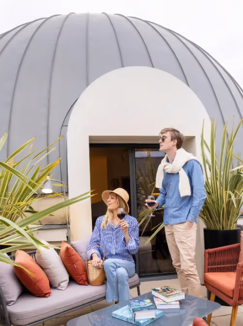 Couple on the roof terrace for a romantic stay in a furnished apartment hotel, Yuna.