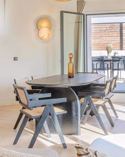 Large dining table in a furnished apartment for long-term rental for corporate housing, Yuna.