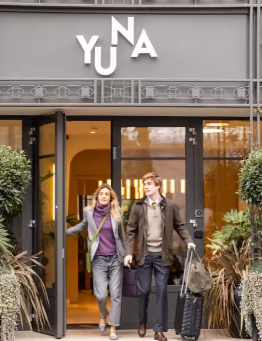 Couple leaving the hotel residence after a long term business stay, Yuna.