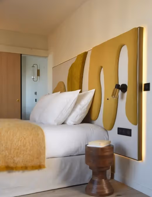 Focus on a double bed in a hotel residence for short term rental, Yuna.