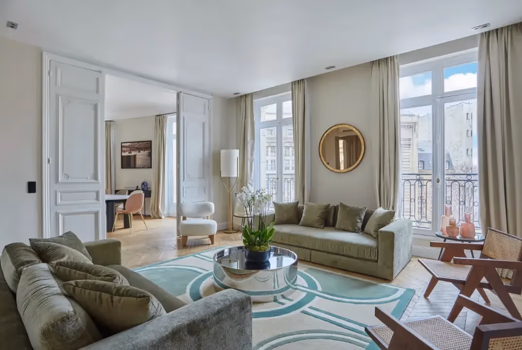 Bright Haussmannian living room with high ceilings in a furnished apartment for a long term stay, Yuna.