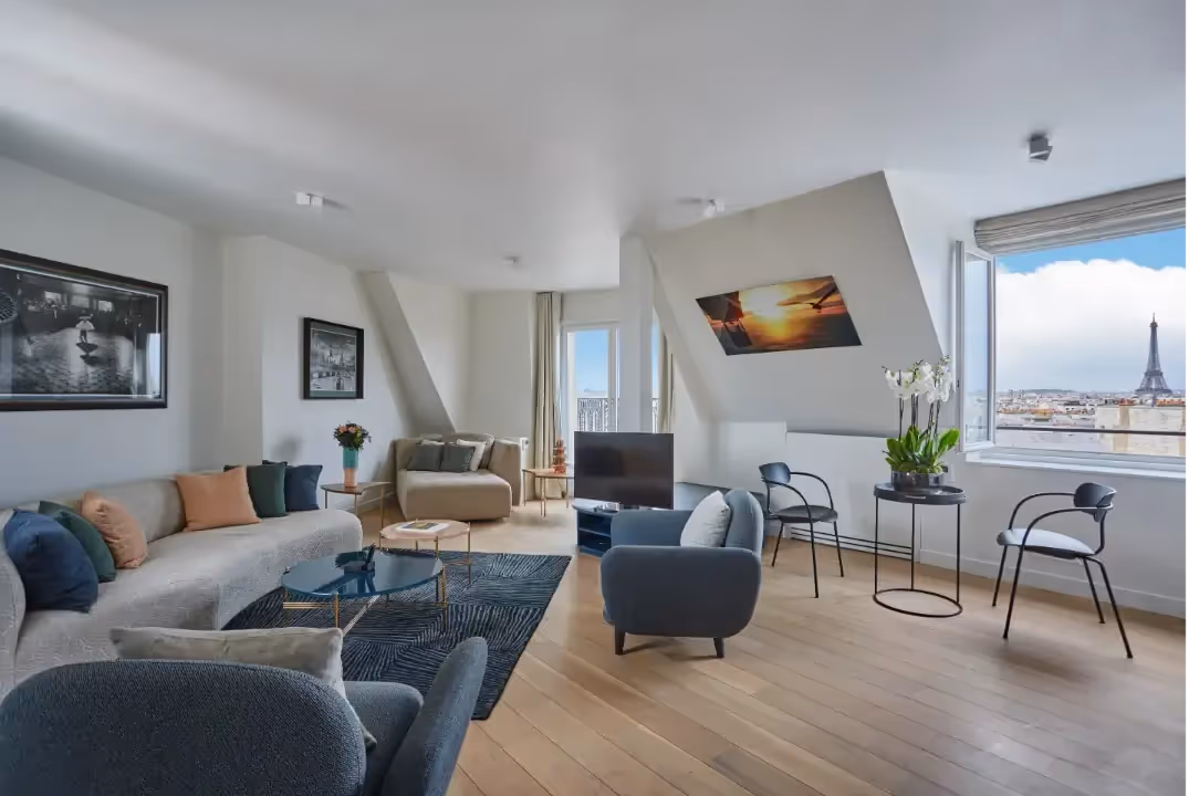 Bright living room overlooking the Eiffel Tower in a furnished apartment for business stays and short-term rentals, Yuna.