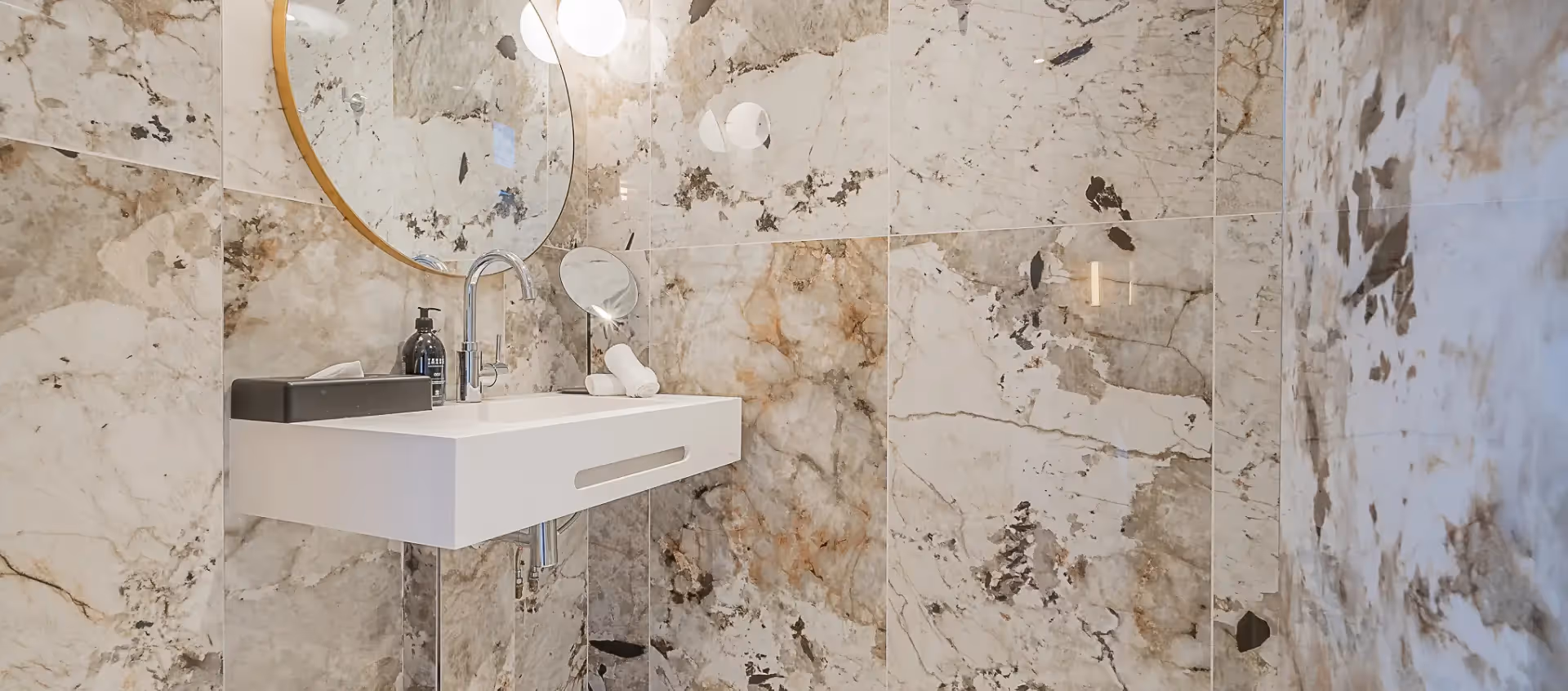 Marble bathroom in a furnished apartment hotel for business stays and long-term rentals, Yuna.