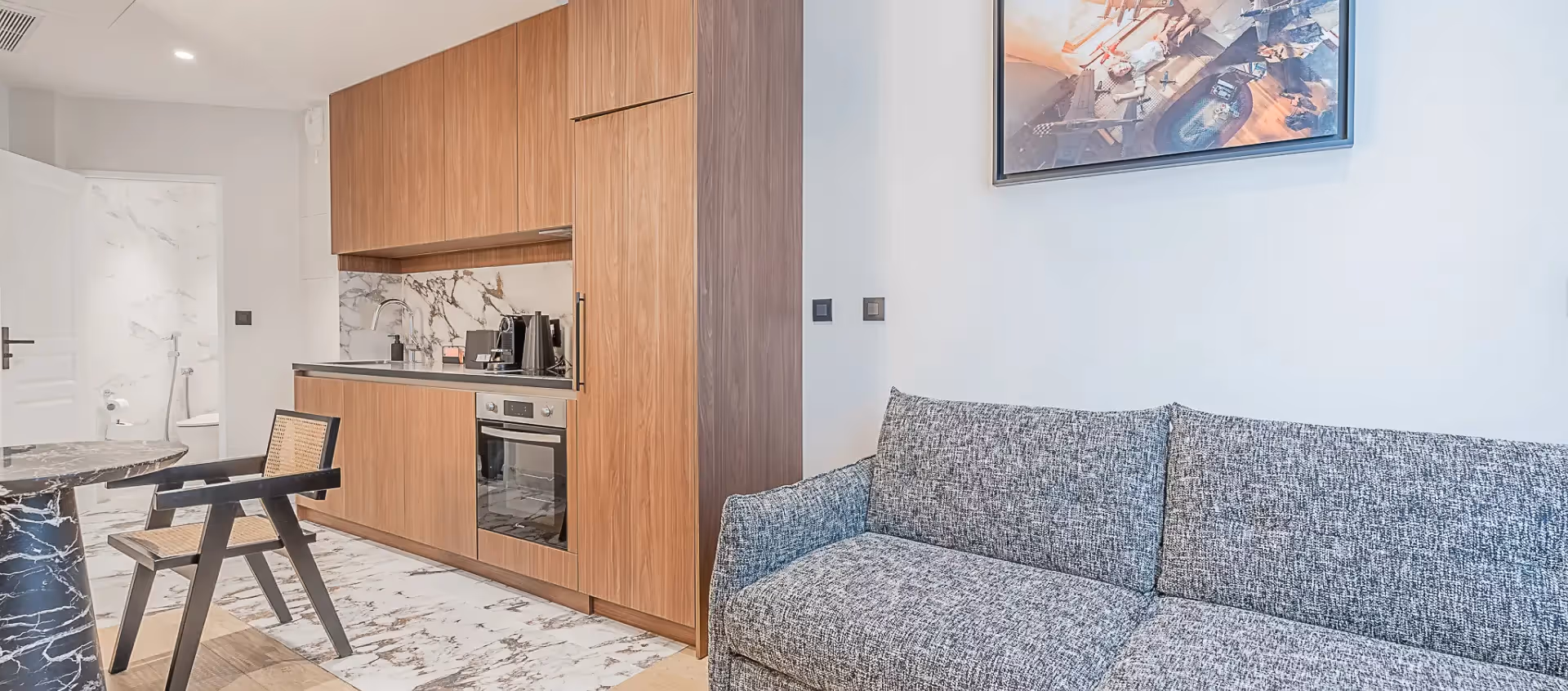 Marble living room and kitchen in a furnished apartment for business stays and long-term rentals, Yuna.